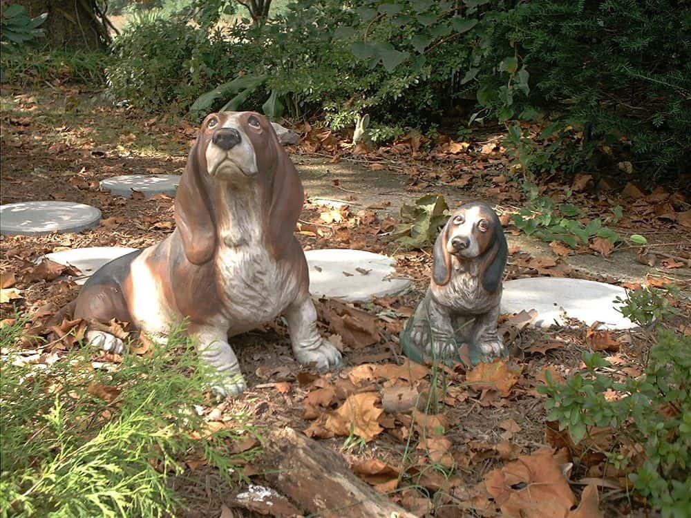 Basset and Puppy.  Debbie used her first Basset, Suzie, as model for both statues. 